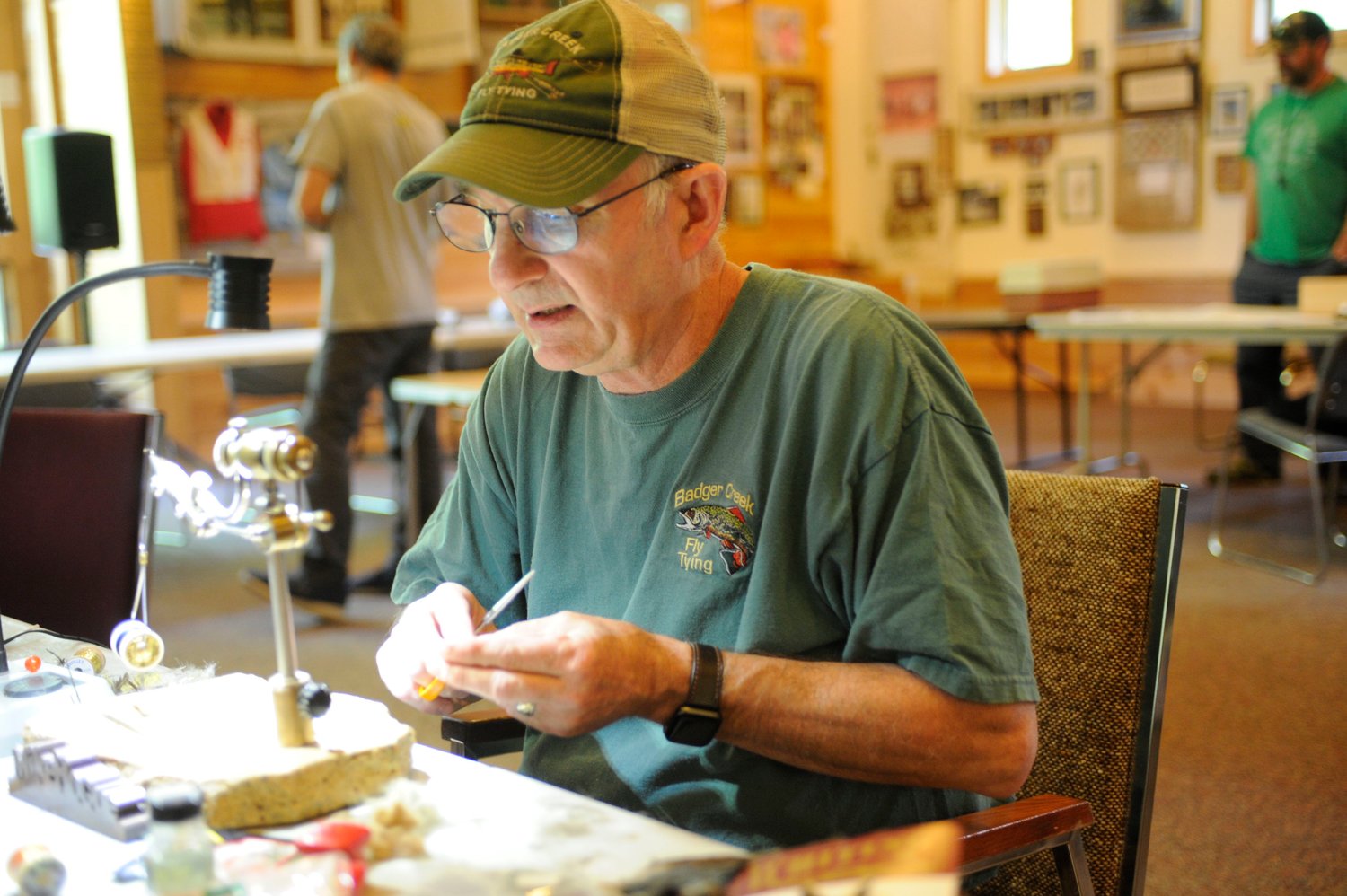 Focal point. Michael Hogue of Badger Creek Fly Tying in Freeville, NY, concentrates on creating a hand-tied fly...